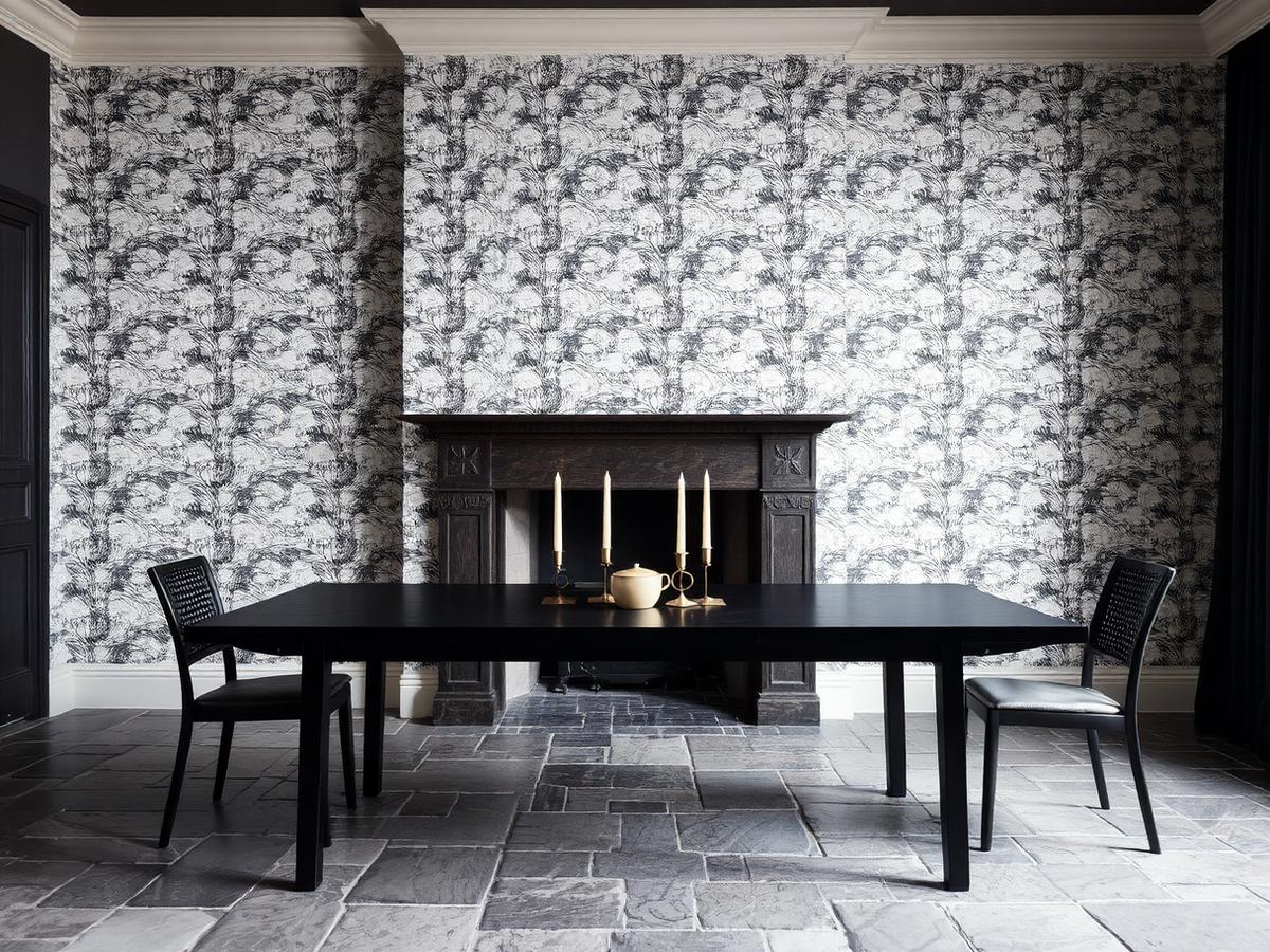 Dining wall hung with a large-scale patterned wallpaper
